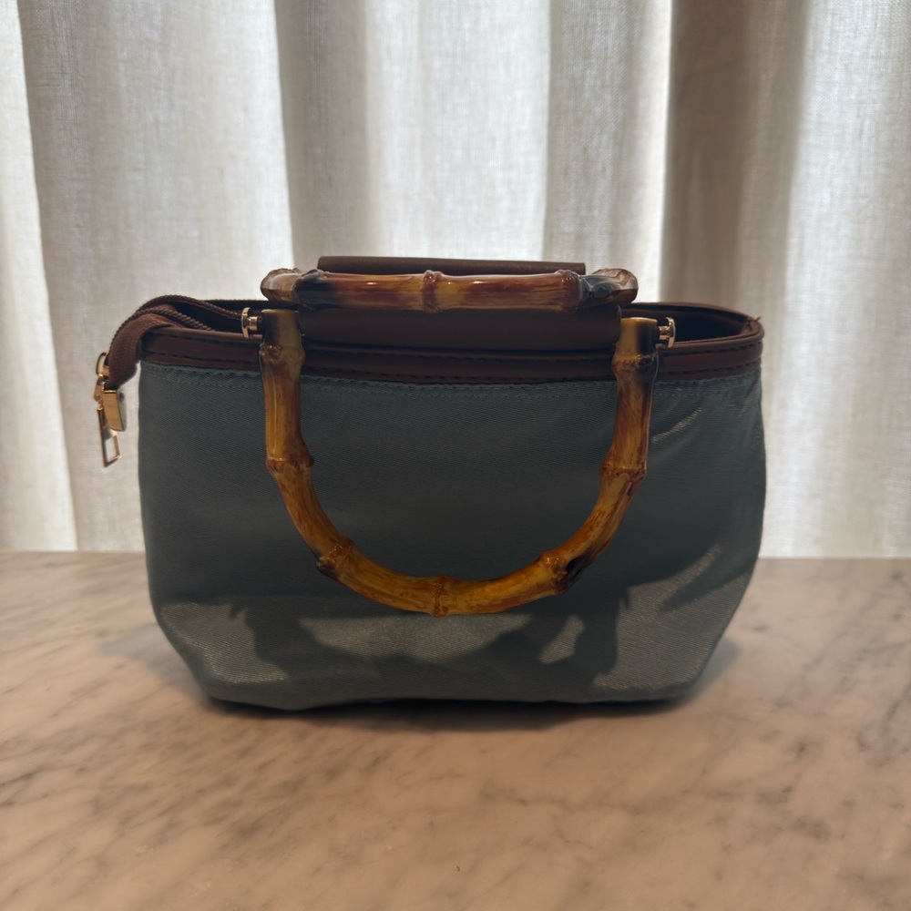 Light blue purse with faux bamboo handles